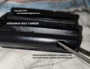 File knocking burr of edge of cam pin slot in VersaMax bolt carrier